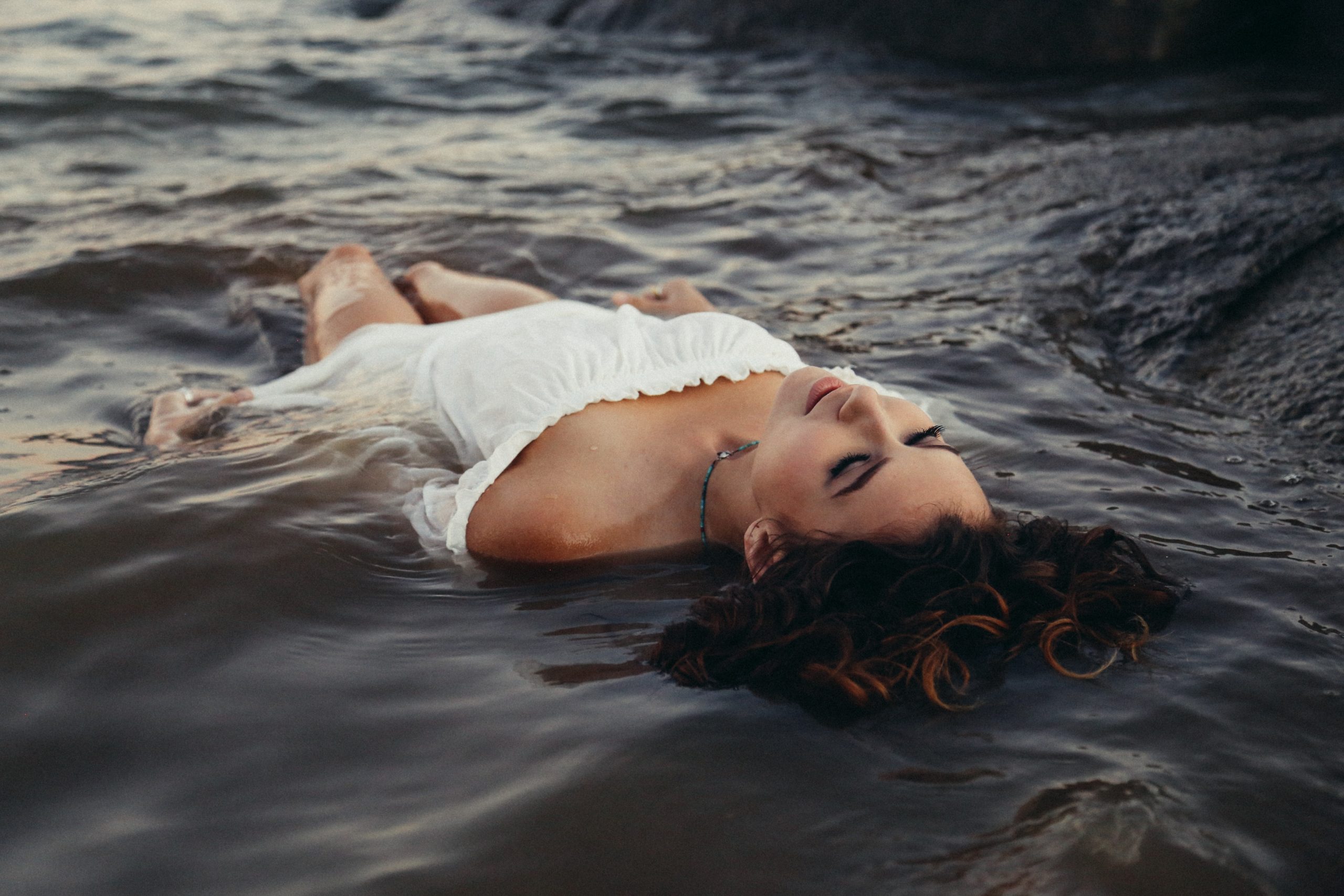 girl laying down in water