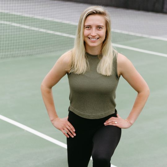 Dr. Madison Oak lunging on a tennis court
