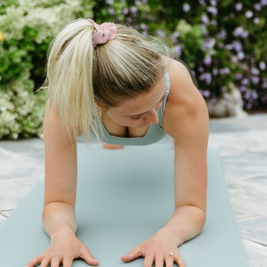 dr madison holding a plank position to show she's leading an active lifestyle